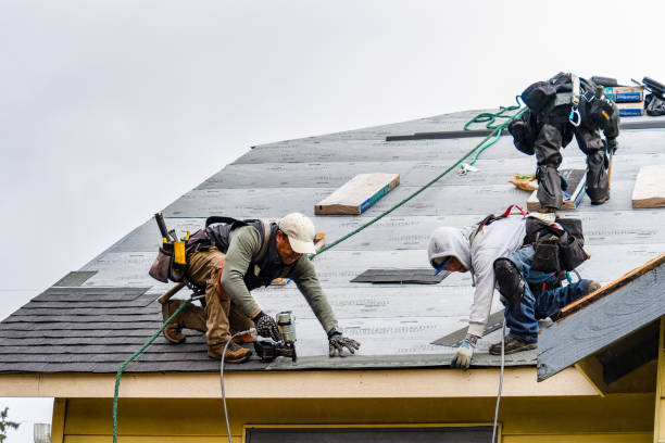 Professional Storm Damage Roof Repair technician working in Washington Mills, NY